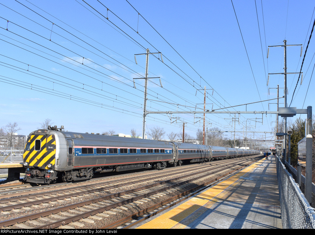 Amtrak Train # 121, being led by Ex-Metroliner Cab Car # 9646, is about to make its station stop at Princeton Jct. This train is running almost 30 minutes late. 